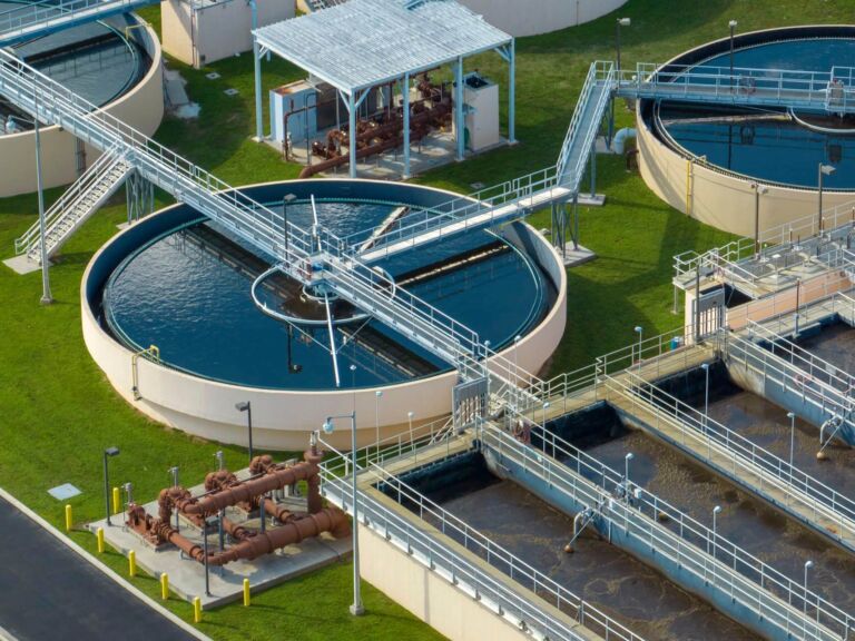 img-water-plant Aerial View Of Modern Water Cleaning Facility At Urban Wastewater Treatment Plant. Purification Process Of Removing Undesirable Chemicals, Suspended Solids And Gases From Contaminated Liquid