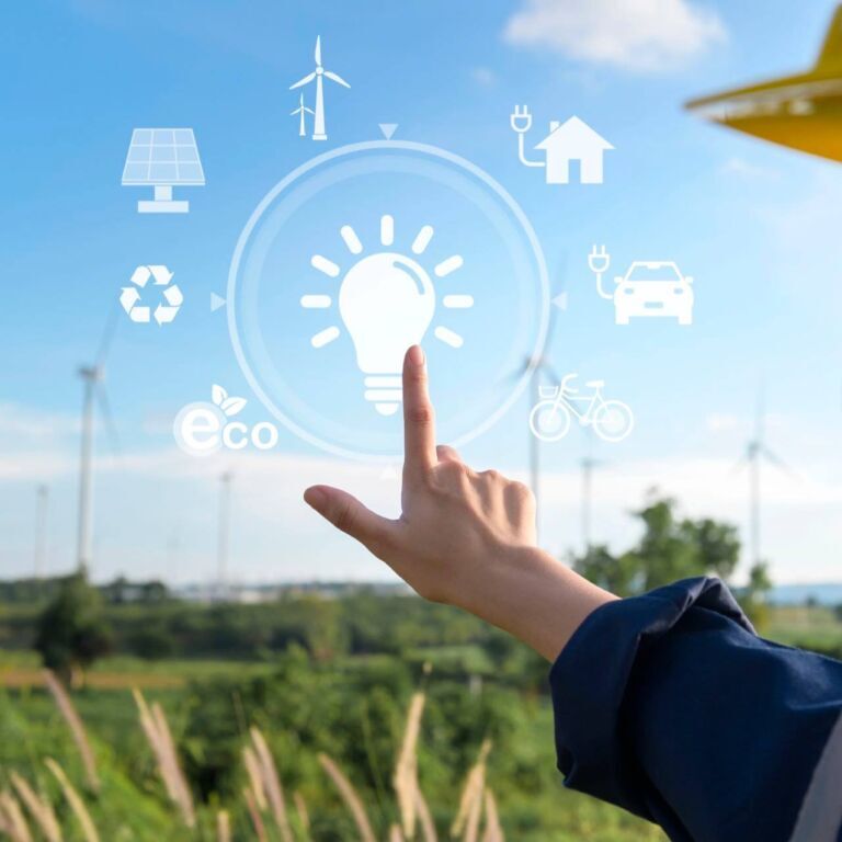 img-green-energy Close Up Engineering Woman Hand Is Touching Virtual Reality Analytics Engineering Data In A Field Over Electrical Turbines Background