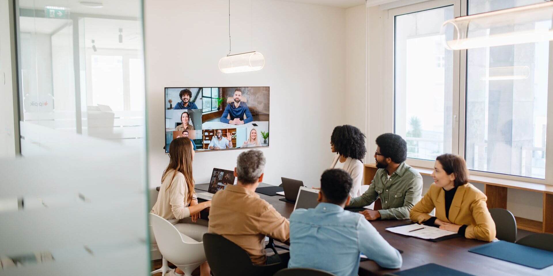 img-team-conference A Diverse Team Of Professionals Enthusiastically Participates In A Video Conference Call